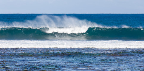 Image showing Rainbow colors in spray from waves