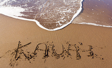 Image showing Kauai written in sand with waves