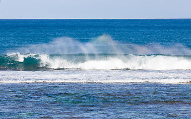 Image showing Rainbow colors in spray from waves