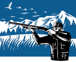 Image showing hunter aiming shotgun rifle