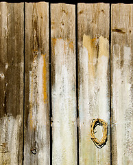 Image showing Old wooden rural house wall made of plank backdrop 