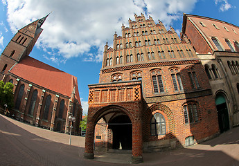 Image showing Old city hall in Hanover, Germany, built in the common brickwork style of northern Germany (Northern German Brickstone Gothic, 15th century). The building on the left is the Marktkirche.