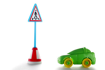 Image showing Green car behind pedestrian crossing road sign