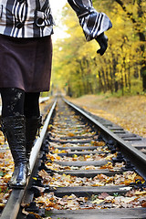 Image showing Women walking on rails