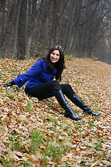 Image showing Young woman in the autumn park