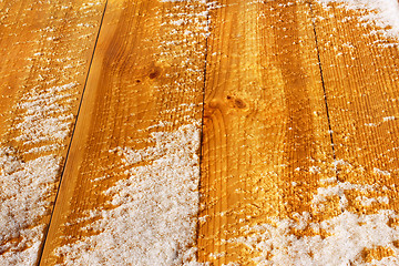 Image showing Wooden shield covered with snow