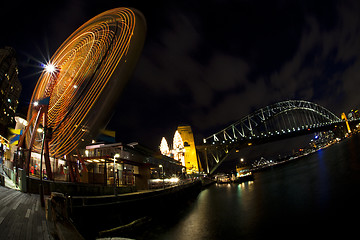 Image showing Ferris wheel in the front of Sydney Harbour Bridge