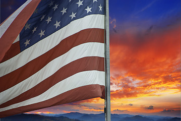 Image showing Sunset over American Flag