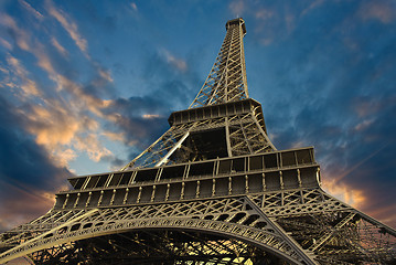 Image showing Eiffel Tower at Sunset against a Cloudy Sky