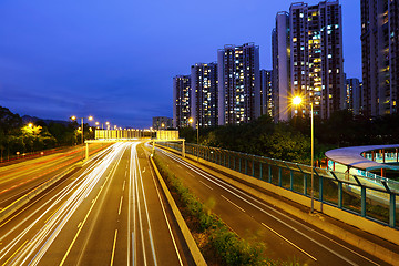 Image showing car light trails in modern city