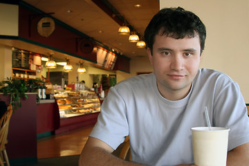 Image showing Man sitting in a coffee shop