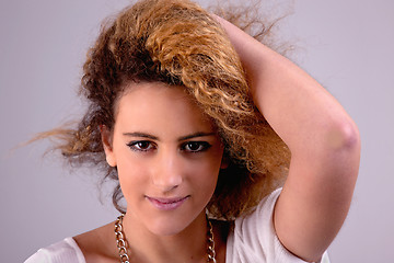 Image showing Beautiful woman  with hands holding the hair