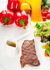 Image showing juicy BBQ grilled rib eye ,ribeye steak and vegetables