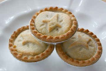 Image showing three fruit pies stacked