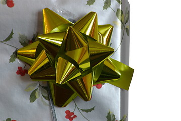 Image showing present and golden bow closeup