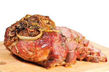 Image showing Roast pork on a wooden board