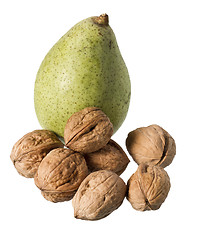 Image showing one pear and many nuts