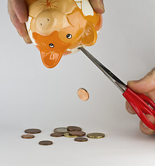 Image showing getting money out of piggybank