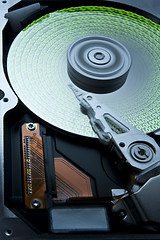 Image showing hard disk with green data on platter -aah-