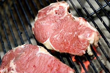 Image showing thin sliced shell steaks on grill