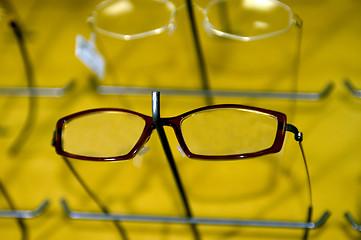 Image showing eyeglasse frames on wall display