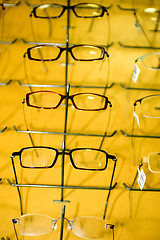 Image showing eyeglasse frames on wall display