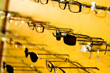 Image showing eyeglasse frames on wall display