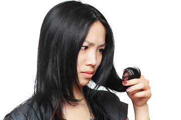 Image showing Young woman have hair problem