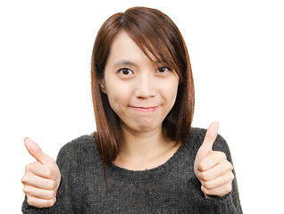 Image showing Smiling woman with thumbs up