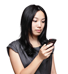 Image showing girl sms on mobile phone