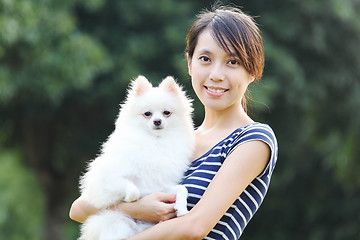 Image showing Young girl with dog