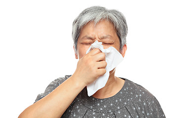 Image showing sneezing mature woman