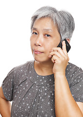 Image showing mature woman using mobile phone
