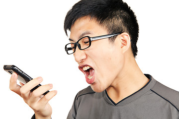 Image showing man yells to his phone 