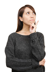 Image showing thoughtful woman looking up