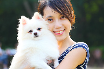 Image showing Young girl with dog