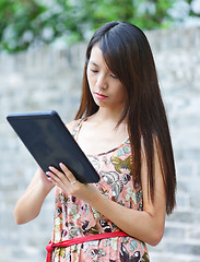 Image showing young woman using tablet touch computer