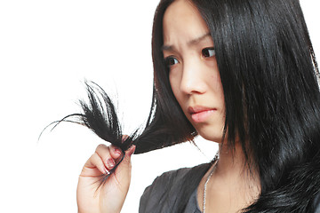 Image showing Young woman have hair problem