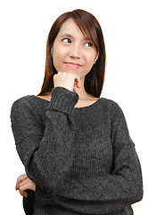 Image showing thoughtful woman looking up