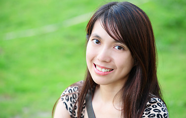 Image showing young woman smiling friendly