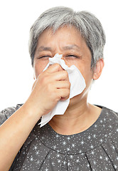 Image showing sneezing mature woman