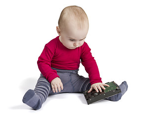 Image showing young child in white background with hard drive