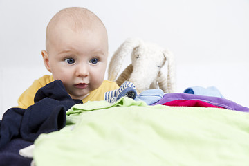 Image showing young cild with washing and toy