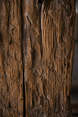 Image showing Dark rough wood