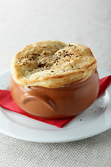 Image showing pancake on brown pot