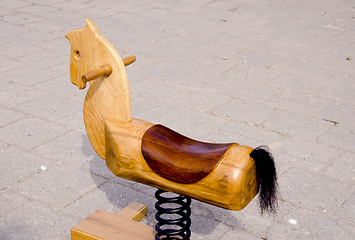Image showing Swing wooden horse toy for kids carved spring tail 