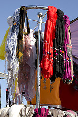 Image showing Headscarf cloak and colorful scarves sell market 