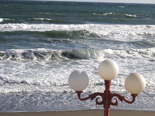 Image showing globe street light infront of the ocean