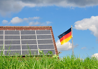 Image showing Roof with solar panels and German flag