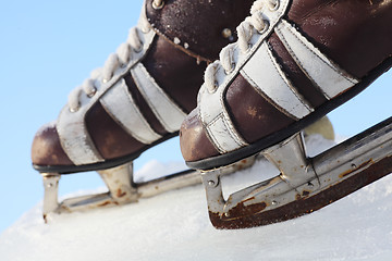 Image showing vintage pair of mens  skates on the ice